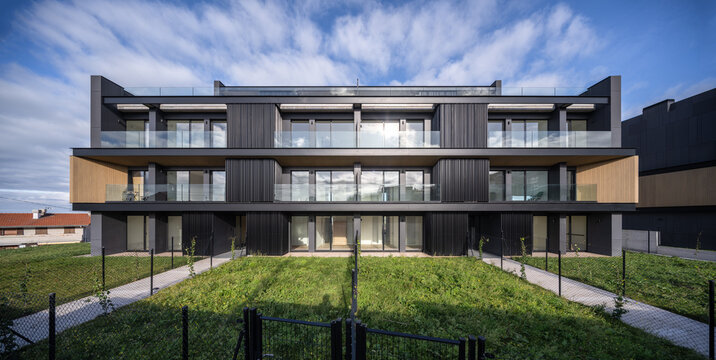 Modern hillside residential apartment building with glass facade