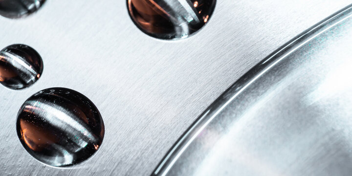 Metallic tech background with reflective water droplets