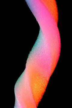 Neon colored foam texture on black background