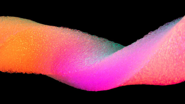 Neon colored foam texture on black background