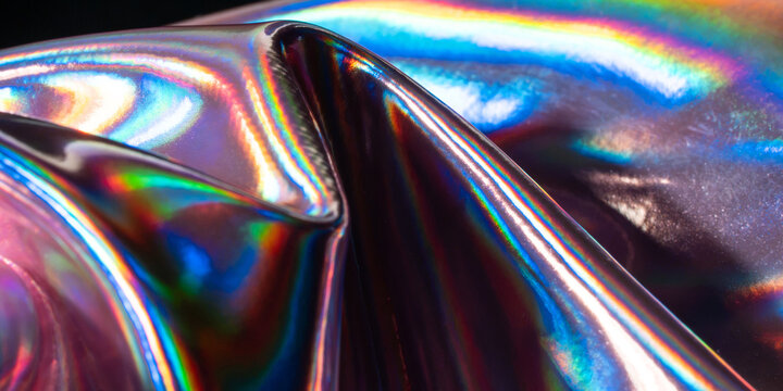 Iridescent holographic metal texture with vibrant rainbow reflection