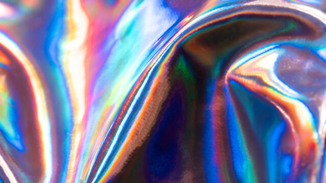 Iridescent holographic metal texture with vibrant color
