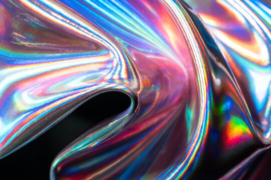 Holographic metal surface with colorful abstract reflections