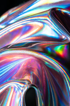 Iridescent holographic metal texture with colorful reflections