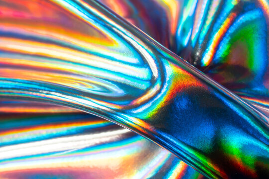 Holographic metal texture with iridescent abstract reflections