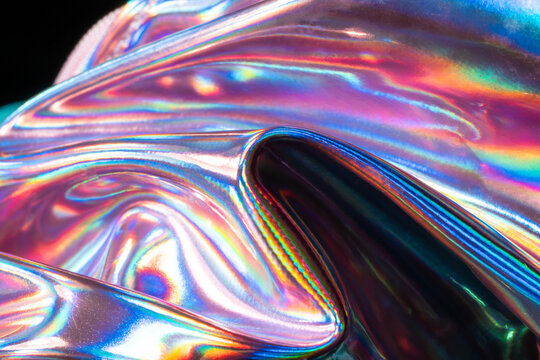 Iridescent holographic metal texture with rainbow reflections