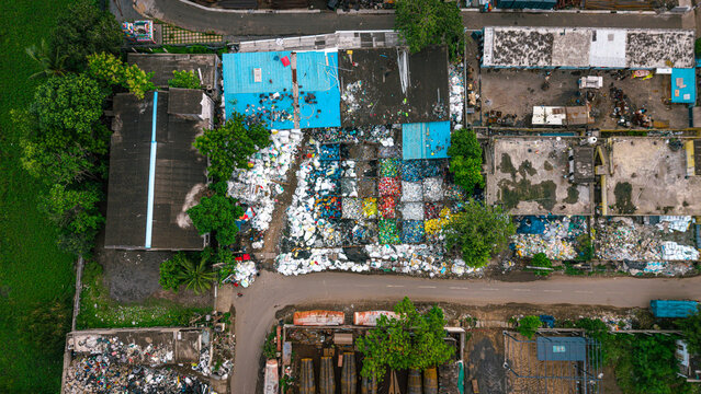 Sorted and segregated waste piles at waste management recycling yard aerial waste segregation facility