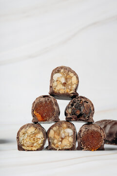 Chocolate-coated date and nut confectionery close-up