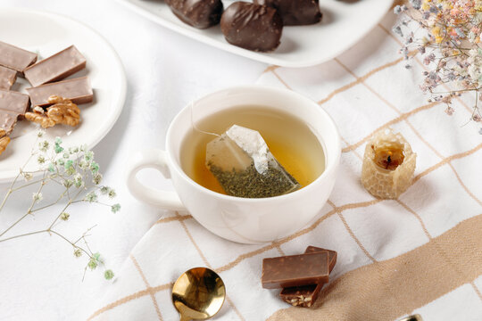 Herbal tea with honeycomb and dried flower arrangement