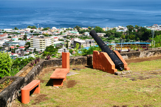 An old historic cannon at the Morne Bruce viewpoint overlooking the coastal city of Roseau in Dominica