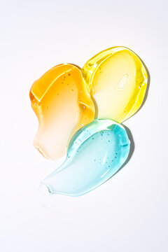 Colorful cosmetic gel smear texture on white background