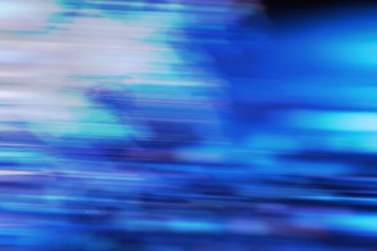 Abstract blue motion blur background with colorful streaks
