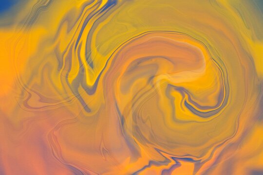 Abstract colorful liquid swirl background in golden tones