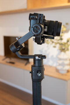 Camera gimbal stabilizer in modern apartment interior
