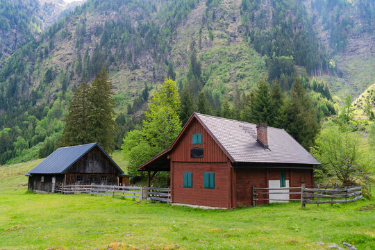 Landscape with mountain village in scenic nature. Travel to village in valley with peaceful houses. Landscape and mountain rural scenery. Travel destination. Rural village houses