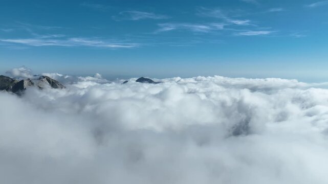 Aerial view of Punta Carina above the clouds, Italy.