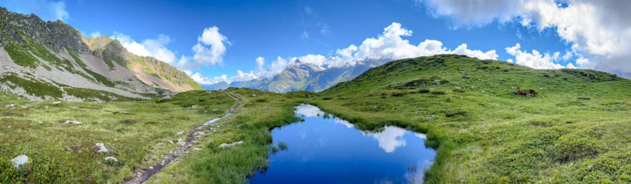 Panoramic alpine landscape with mountain lake facing Mont Blanc, France