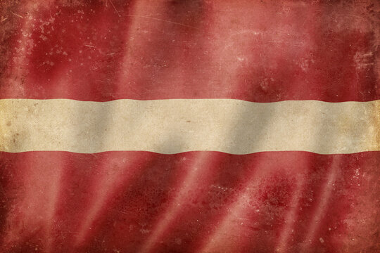 Old vintage flag of Latvia, worn and stained