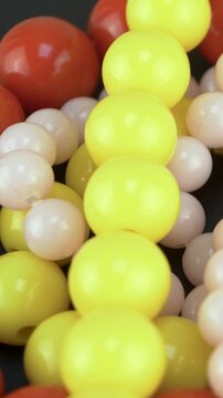 Joyful mix of vibrant beads reflects fun and retro expression. Concept of carnival accessories. Bold colors highlight quirky personality. Plastic textures enhance playful aesthetic