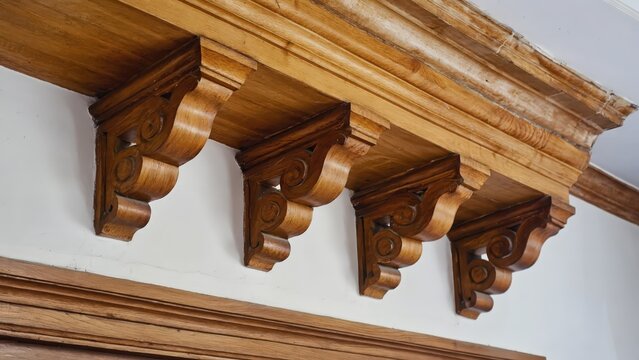 Intricate Wooden Corbel Detail: Decorative Architectural Elements for Home Decor and Interior Design Projects.