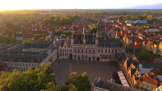 Aerial view of De Burg market square in Bruges city during sunrise Belgium