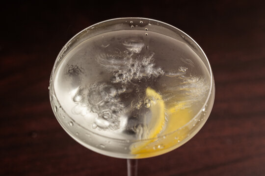 Elegant cocktail in a martini glass. The classic Vesper Martini, stylized background adds moody sophistication. Ideal for upscale bar or cocktail menus