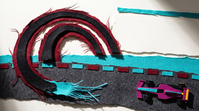 Fabric racetrack with colorful car and stitched road details  