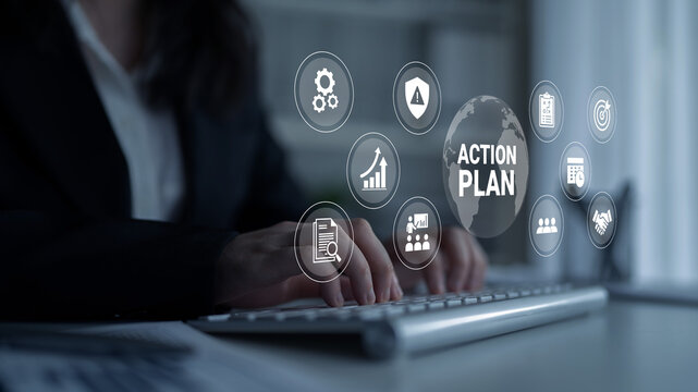 A business professional actively engages with a keyboard in a modern office, surrounded by digital action plan icons, symbolizing strategic planning and productivity. Ledger