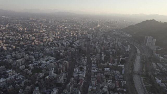 Sunset Aerial Push In View Of Santiago de Chile Urban Landscape And River 