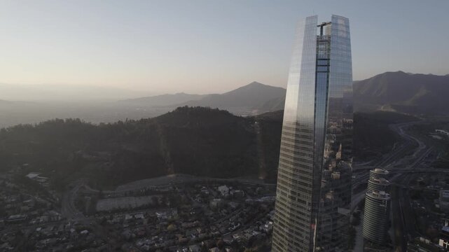 Drone Rotation Over Santiago de Chile With Sun Reflection And Backlight