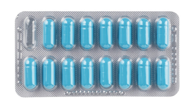 Blue gelatin capsules in blister pack one empty pocket, isolated on transparent background