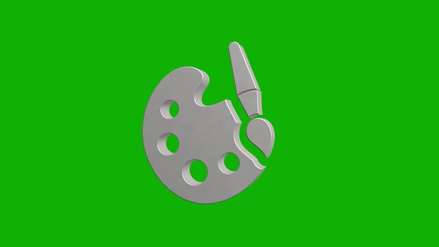 Spinning metallic art palette with brush icon on green screen background.