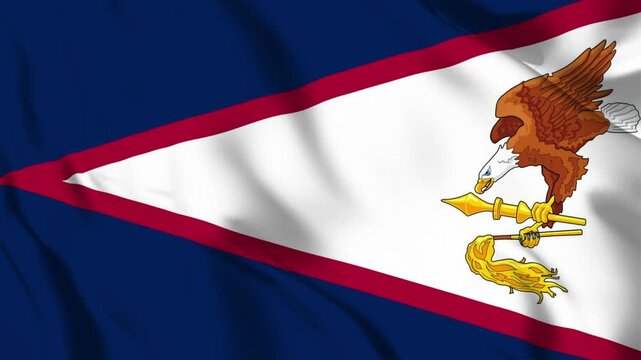 Waving flag of American Samoa with blue white and red triangle design and eagle emblem bird