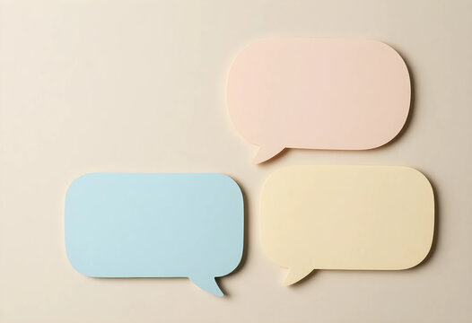 Communication and feedback concept, colorful speech bubbles for messaging and social media interaction on a neutral background with copy space for text