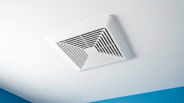 New restroom air ventilation fan duct system mounted on a white ceiling.