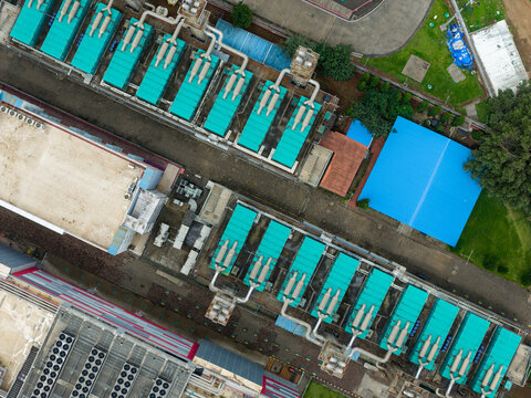 Aerial view of Nxtra Data Centre featuring rows of industrial cooling units and pipes on the rooftop in Hinjawadi, Maharashtra, India.
