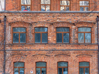 Four windows of the old mansion 19 century with brown bricks wall © Dmitrii Potashkin