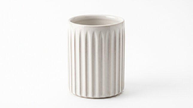 Minimalist white ceramic fluted vase, modern ribbed porcelain cup on white background, elegant textured pottery vessel for home decor