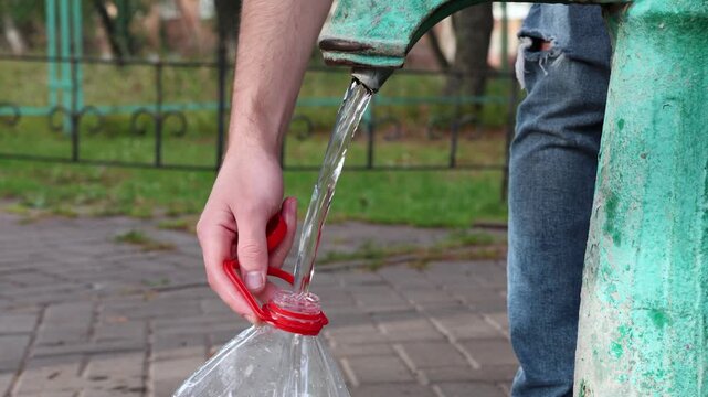 Man Lifting Water Bottle