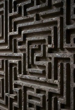 Complexity and problem solving, stone maze wall with intricate geometric patterns for business strategy and decision making challenges in architecture