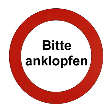 Rundes Schild mit rotem Rand und der Aufschrift "Bitte anklopfen"	