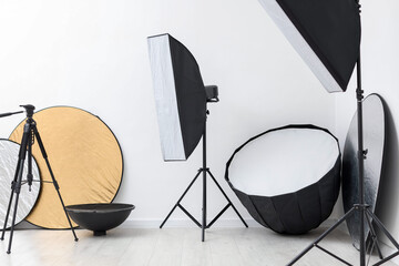 Different modern lighting equipment and tripod in photo studio © New Africa