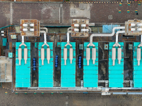 Aerial view of Nxtra Data Centre featuring industrial cooling units and turquoise equipment on the rooftop in Hinjawadi, Maharashtra, India.