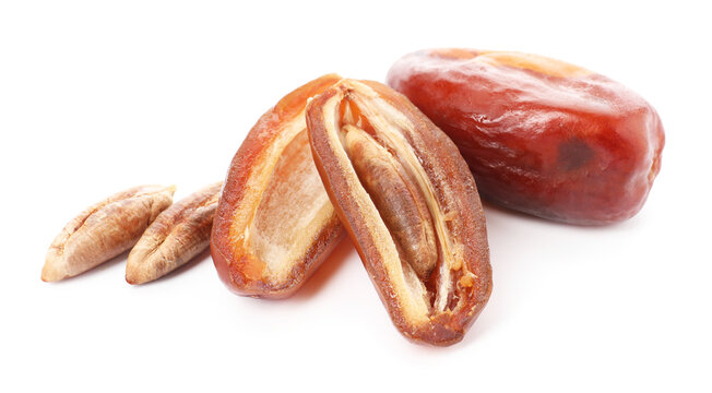 Whole and cut dried date isolated on white