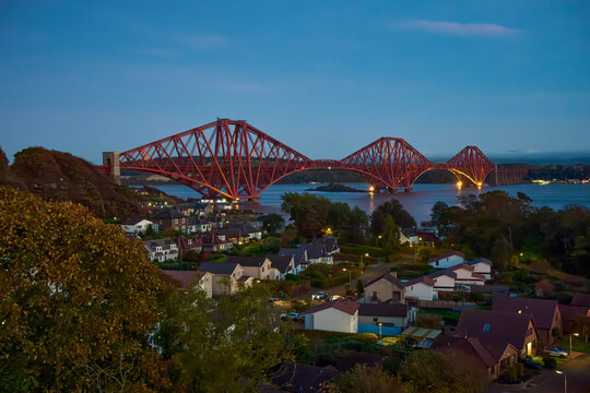 Forth Bridge spanning the Firth of Forth above South Queensferry at blue hour