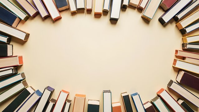 Wide realistic banner with colorful books forming frame around empty center space