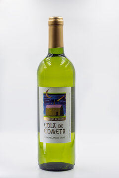 Cola de Cometa Spanish white wine bottle closeup on white.
