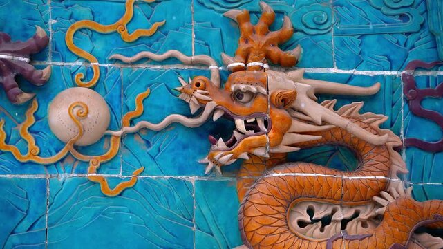 Orange Chinese Dragon Glazed Ceramic Wall Art on Blue Background