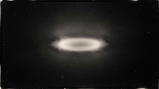 Abstract glowing oval light ring on a dark textured background