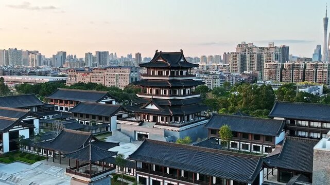 Traditional Chinese Pavilion and Modern Guangzhou Skyline at Sunset in Guangzhou, China